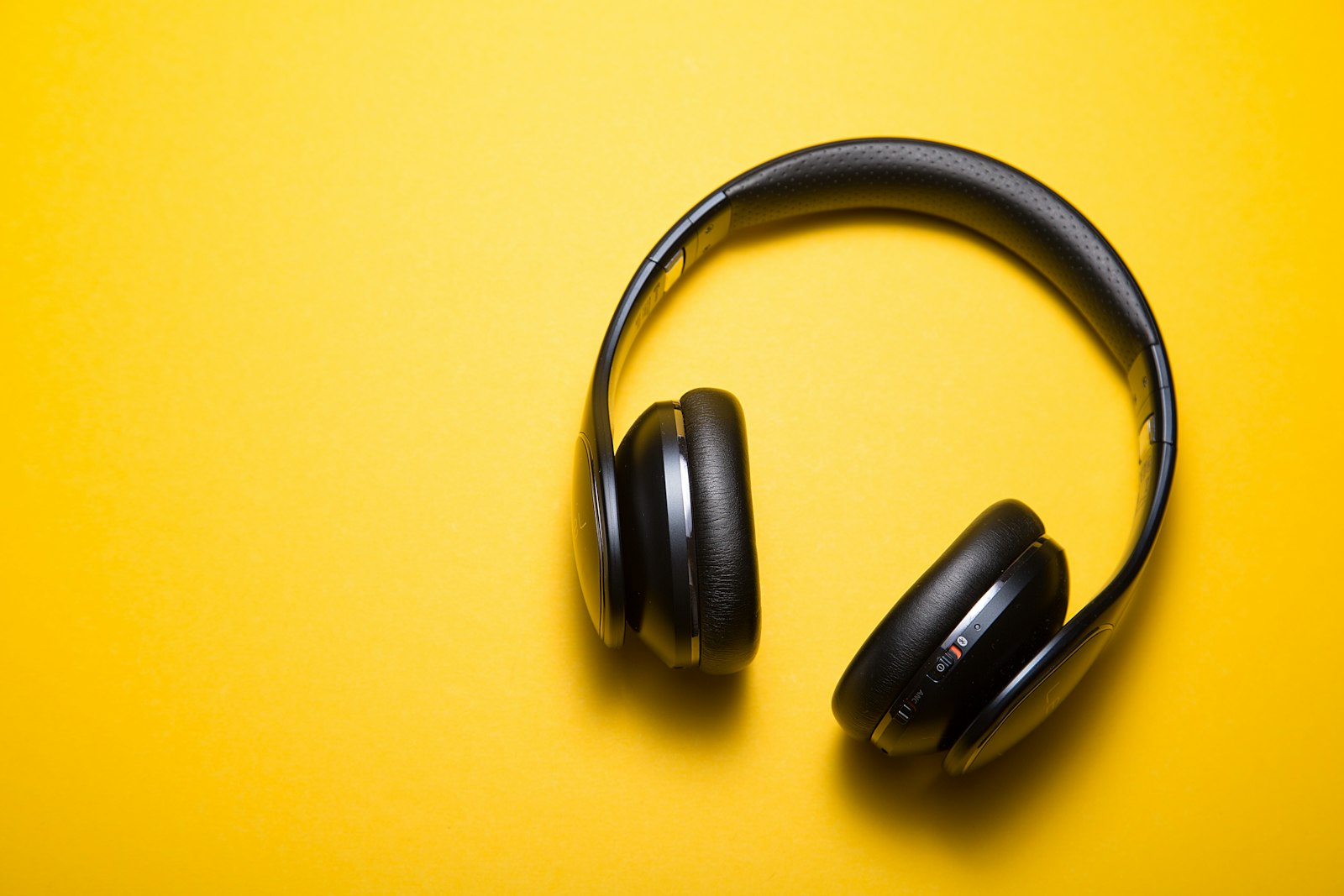 A pair of headphones on a bright background, ready for an audition.